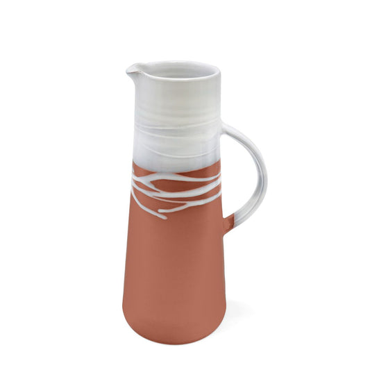 This stunning Paul Maloney Pottery Terracotta X-Large Jug is handmade with care. The simple, clean design features a high-quality stoneware with a Terracotta glaze, making it a perfect decorative piece. It is perfect for serving drinks or filling with flowers.