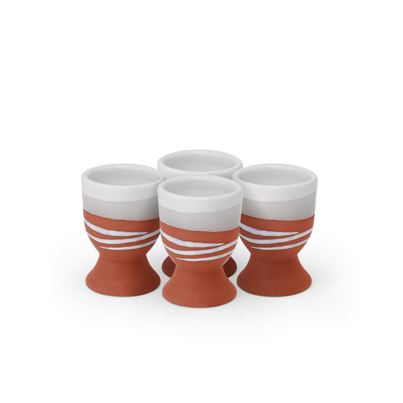 A modern twist on a classic style, this Paul Maloney Pottery Terracotta Set of 4 Egg Cups adds sophistication to your table settings. Crafted from durable and long-lasting stoneware, these egg cups are made to withstand the test of time and will be a staple of your kitchenware for years to come. Perfect for your morning eggs, they're sure to be a welcome addition to any kitchen.