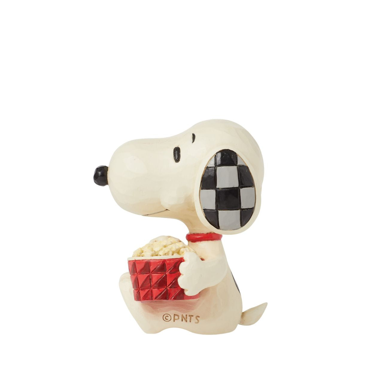 The ever so cheeky Snoopy is having the best time with a large tub of popcorn, ready to watch his favourite film. Mini figurine from the Peanuts collection by Jim Shore. Comes in fully branded packaging.