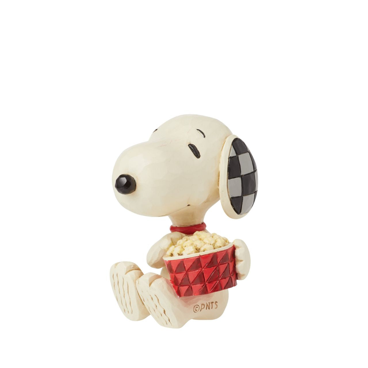 The ever so cheeky Snoopy is having the best time with a large tub of popcorn, ready to watch his favourite film. Mini figurine from the Peanuts collection by Jim Shore. Comes in fully branded packaging.