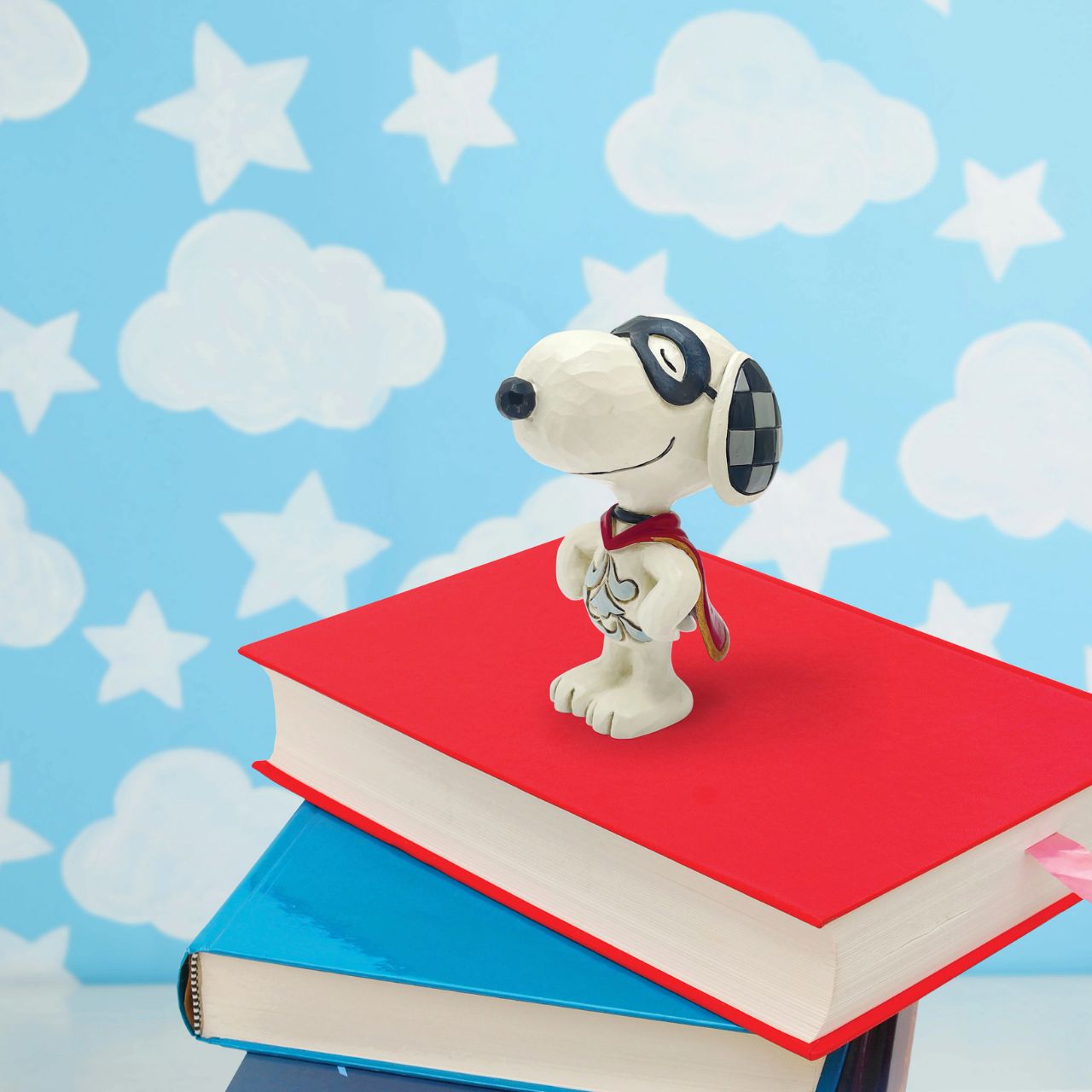 Is it a bird? Is it a plane? No it's Snoopy. Dressed in his superhero cape, Snoopy is the perfect gift for the hero in your life. This mini figurine by Jim Shore comes in fully branded packaging.