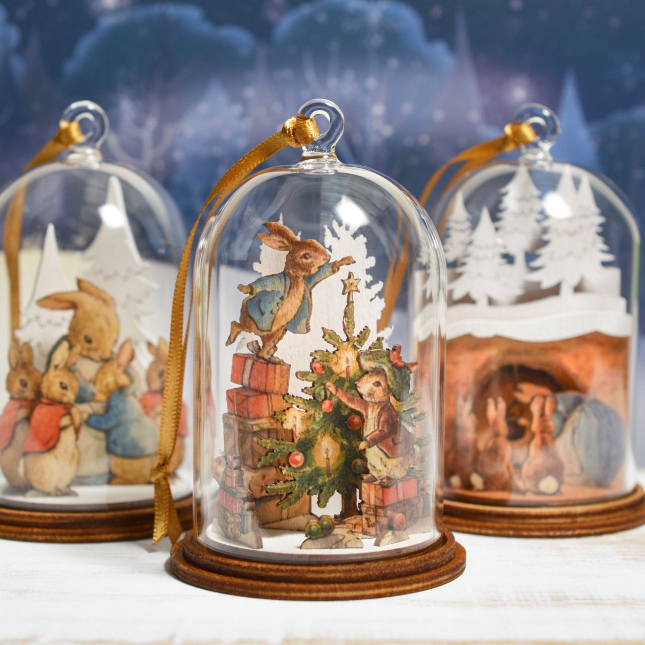 Peter Rabbit and Benjamin Bunny Christmas Wooden Hanging Ornament  This festive Peter Rabbit and Benjamin Bunny wooden hanging ornament has been intricately created and comes encased in a beautiful eco-friendly glass dome. This classic vintage style helps bring to life the original illustrations from the Beatrix Potter stories.