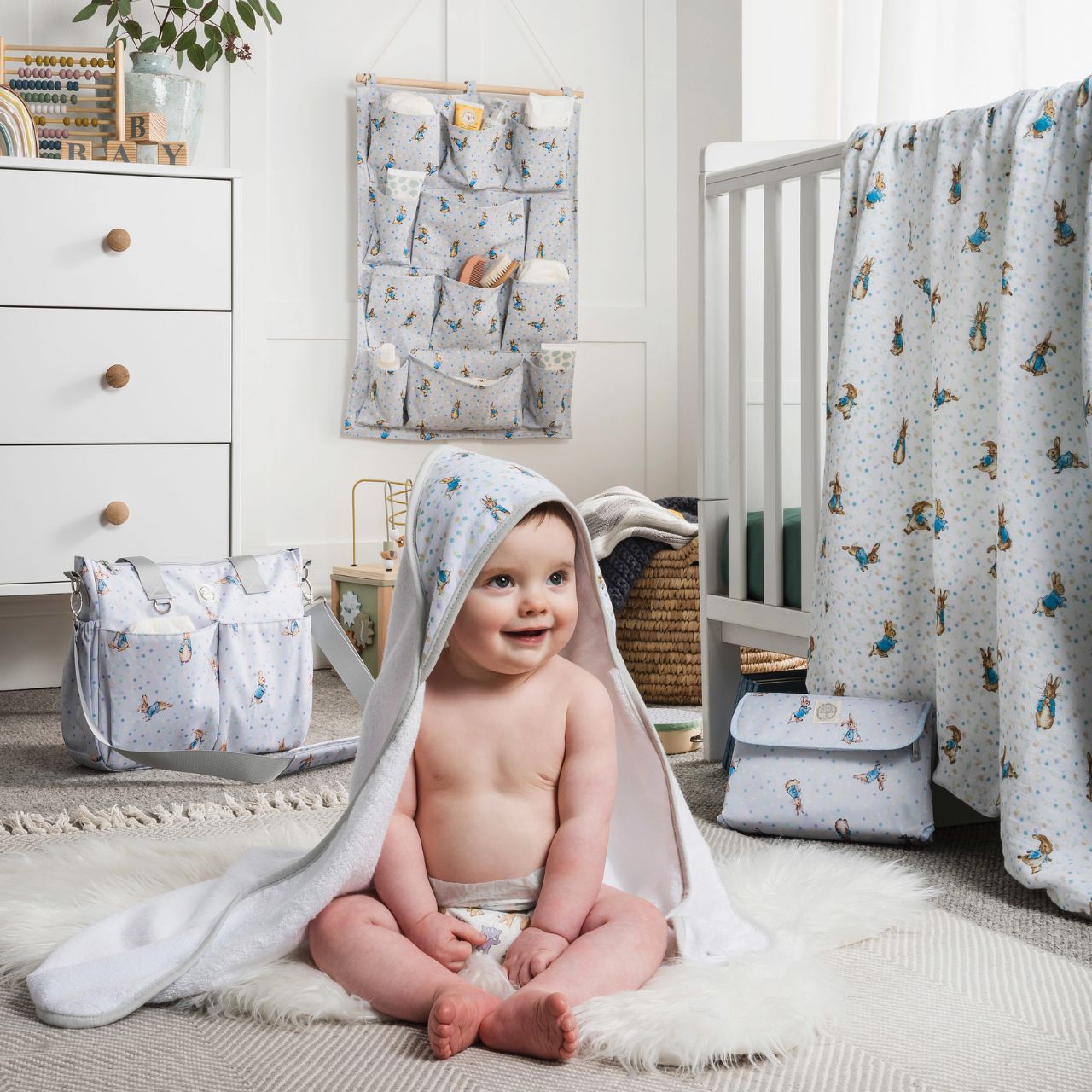 The most adorable hooded Peter Rabbit Towel that you ever did see. This Hooded bath Towel and is for keeping your little one wrapped up warm and snug after bath-time. Made from an ultra-soft and cosy bamboo cotton, terry fabric (70% cotton and 30% bamboo) and Peter Rabbit artworks on the hood. 