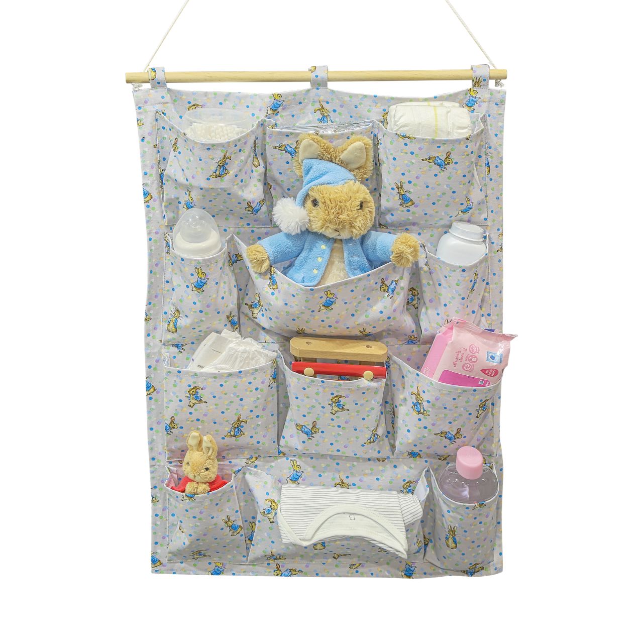 A new format to our Beatrix Potter collection, the Peter Rabbit Nursery Organiser. Featuring 12 individual pockets over 4 shelves, rope to hang the organiser on the wall and a new Peter Rabbit design, this is the ultimate organiser for your nursery.