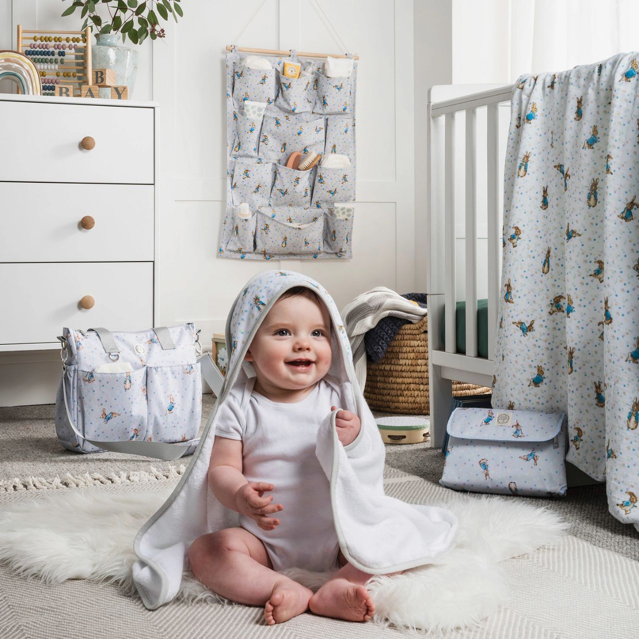 A new format to our Beatrix Potter collection, the Peter Rabbit Nursery Organiser. Featuring 12 individual pockets over 4 shelves, rope to hang the organiser on the wall and a new Peter Rabbit design, this is the ultimate organiser for your nursery.