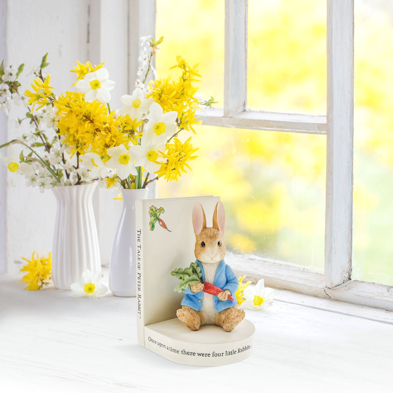 Beatrix Potter Peter Rabbit Book Stop  An ornamental Peter Rabbit bookend, designed with the famous Tale of Peter Rabbit book in mind. An ideal accessory for the living room, home office or home library space. This book stop makes the ideal collector's piece or gift.