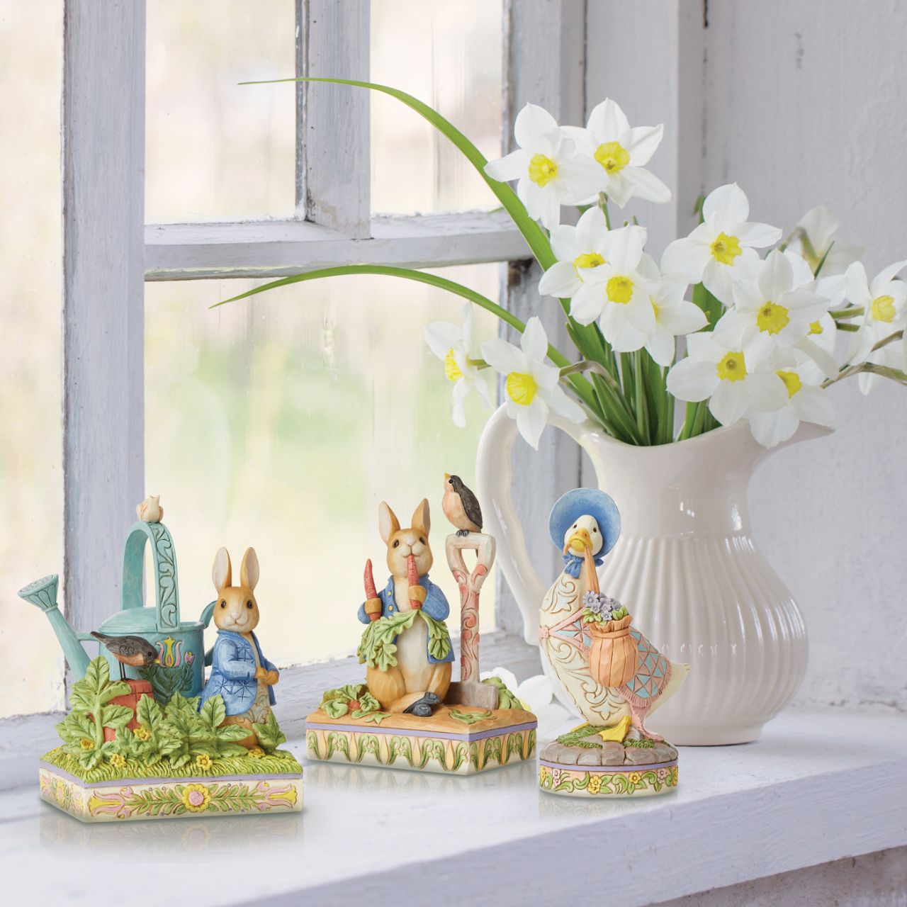 Award winning folk artist Jim Shore brings his unique style to Beatrix Potter's beloved story, The Tale of Peter Rabbit, through charming hand-crafted gifts that will delight her readers of all ages. This Jim Shore figurine features the adventurous Rabbit after he's squeezed under the garden gate to gorge on Mr. McGregor's garden vegetables again.