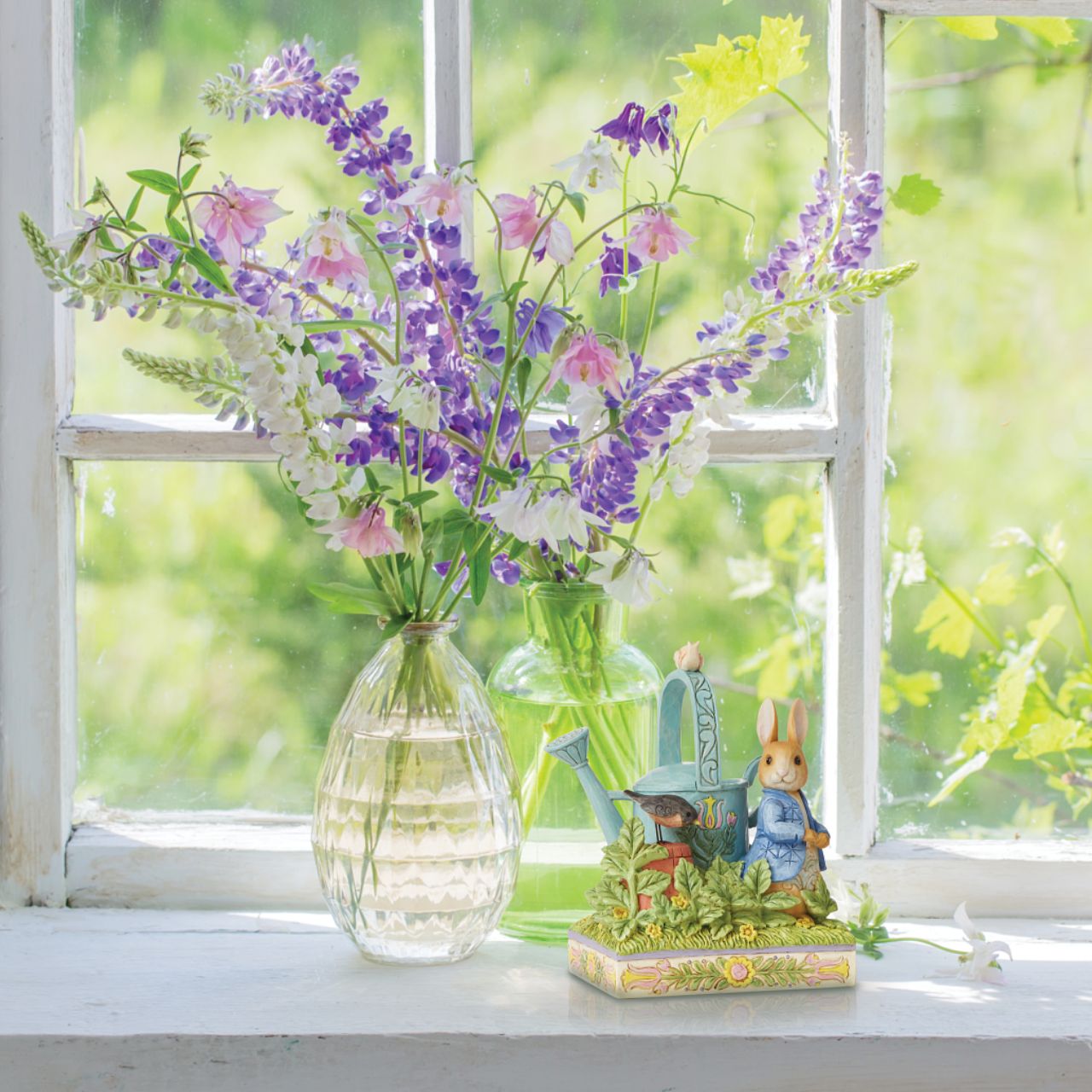 Award winning folk artist Jim Shore brings his unique style to Beatrix Potter's beloved story, The Tale of Peter Rabbit, through charming hand-crafted gifts that will delight her readers of all ages. This Jim Shore figurine features the adventurous Rabbit after he's squeezed under the garden gate to gorge on Mr. McGregor's garden vegetables again.