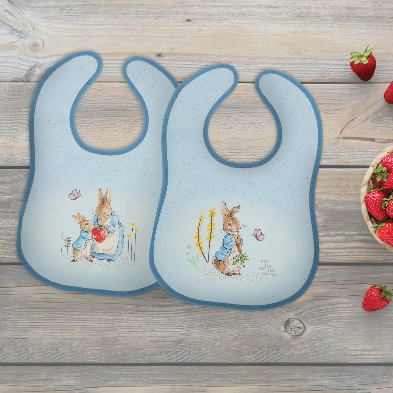 Introducing the delightful Peter Rabbit Bib Set, inspired by the charming tales of Peter Rabbit and friends. This enchanting set of two bibs ensures mealtime is both stylish and mess-free. Crafted with super-soft, wipeable fabric, each bib features an easy hook & loop tape fastening for quick changes.