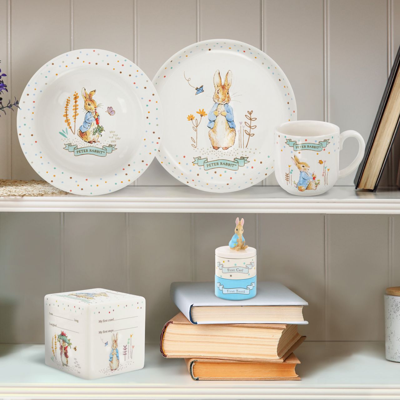 Enhance your store's charm with the Beatrix Potter Stackable Tooth and Curl Set. Featuring our beloved Peter Rabbit, this high-quality keepsake is perfect for nursery and gift sections. It Makes a perfect and unique christening gift.