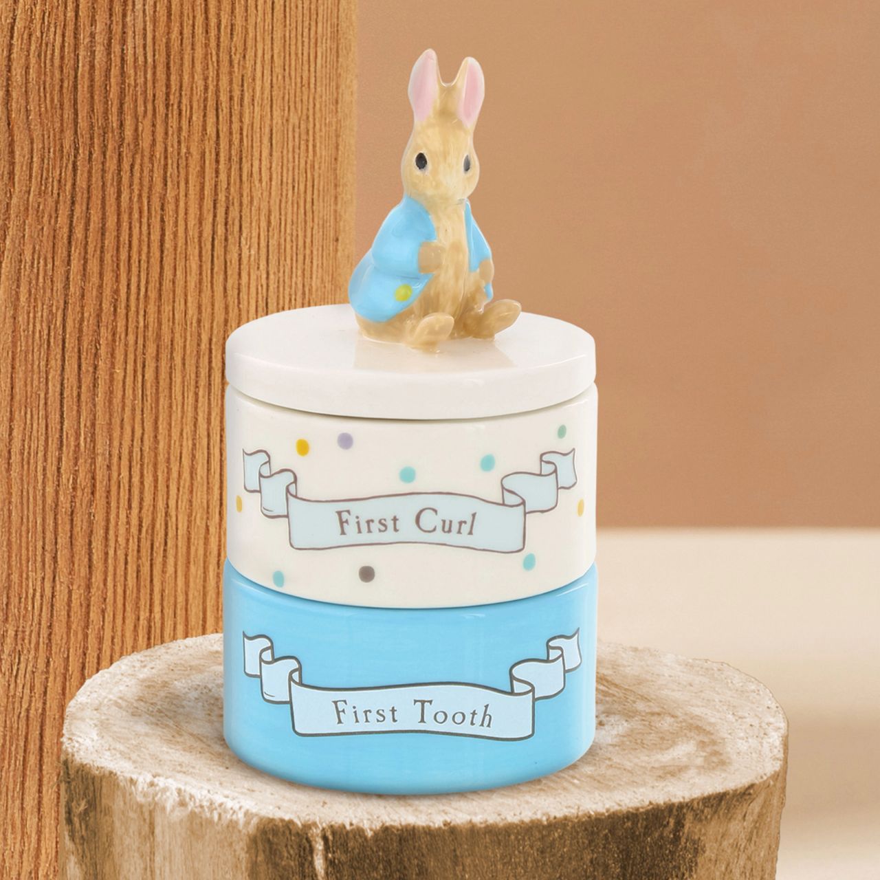 Enhance your store's charm with the Beatrix Potter Stackable Tooth and Curl Set. Featuring our beloved Peter Rabbit, this high-quality keepsake is perfect for nursery and gift sections. It Makes a perfect and unique christening gift.
