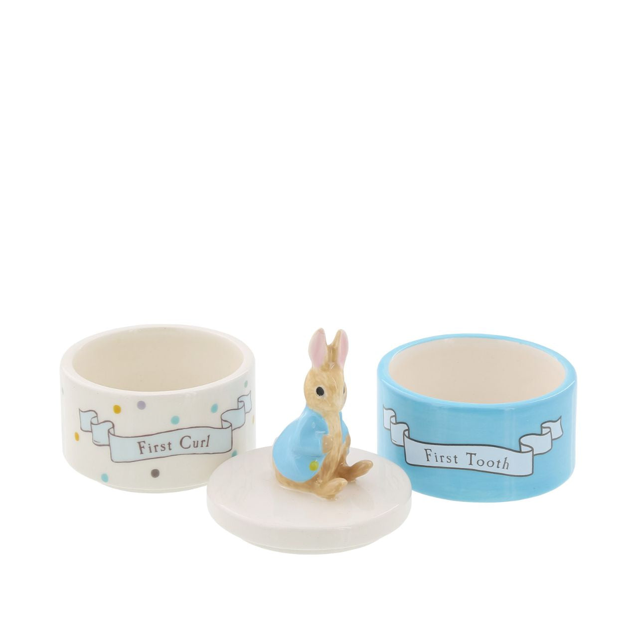 Enhance your store's charm with the Beatrix Potter Stackable Tooth and Curl Set. Featuring our beloved Peter Rabbit, this high-quality keepsake is perfect for nursery and gift sections. It Makes a perfect and unique christening gift.