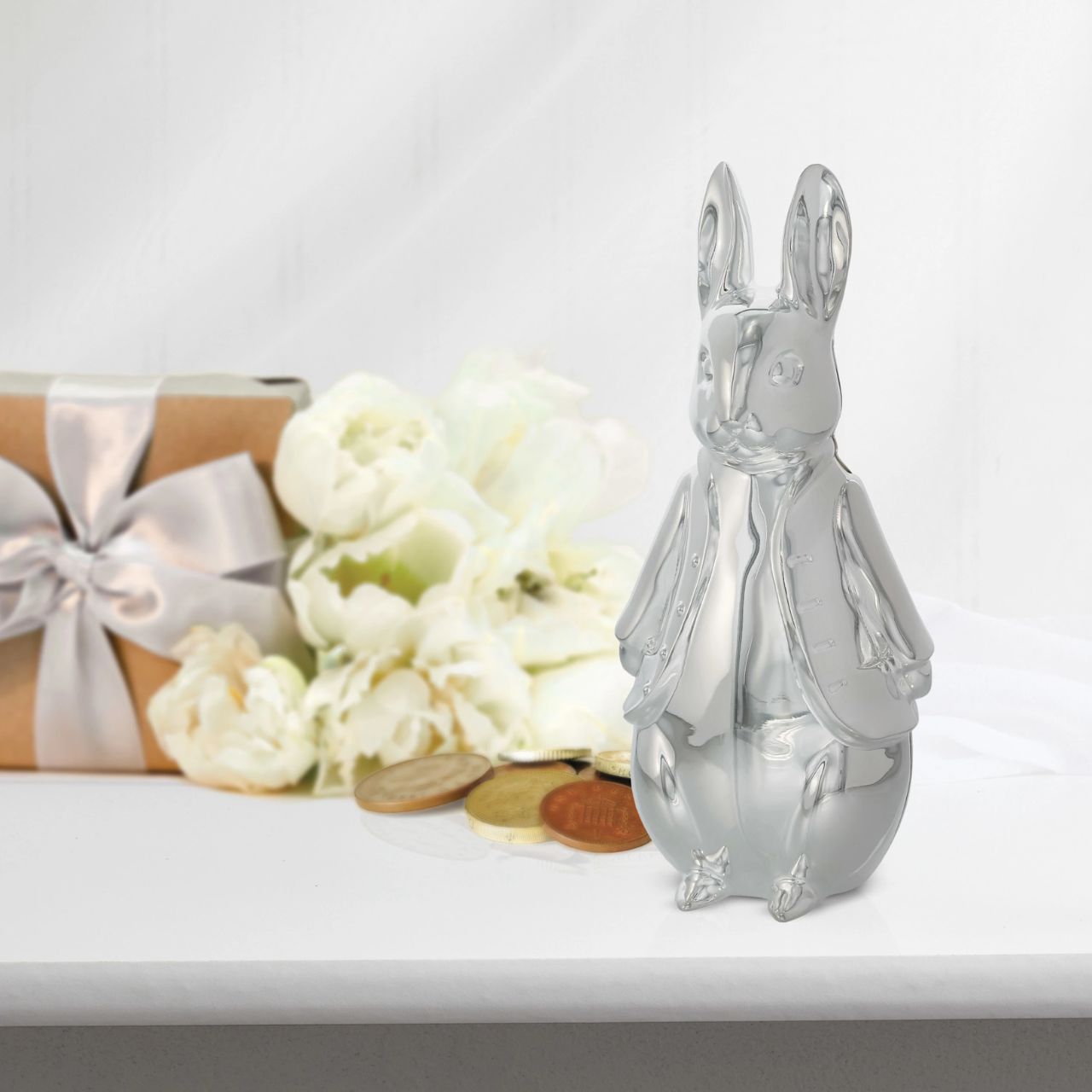 Celebrate a new bundle of joy with the Beatrix Potter New Baby collection. The silver-plated sculpted money bank makes a fantastic gift to store coins and to display in a nursery. With a detailed 3D Peter Rabbit design it will become a treasured possession for new parents and make a beautiful statement piece in a nursery.