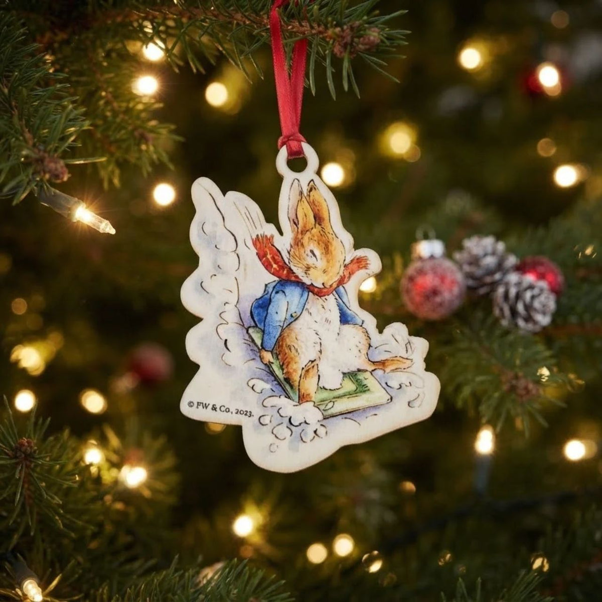 This Peter Rabbit Sledging at Christmas Wooden Hanging Ornament would make a truly unique gift or self-purchase.