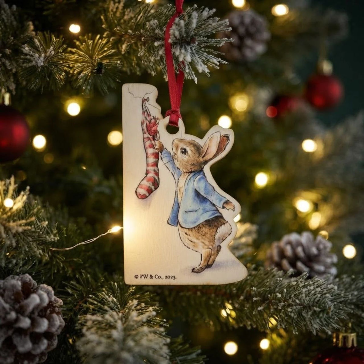 This Peter Rabbit with Christmas Stocking Wooden Hanging Ornament would make a truly unique gift or self-purchase.