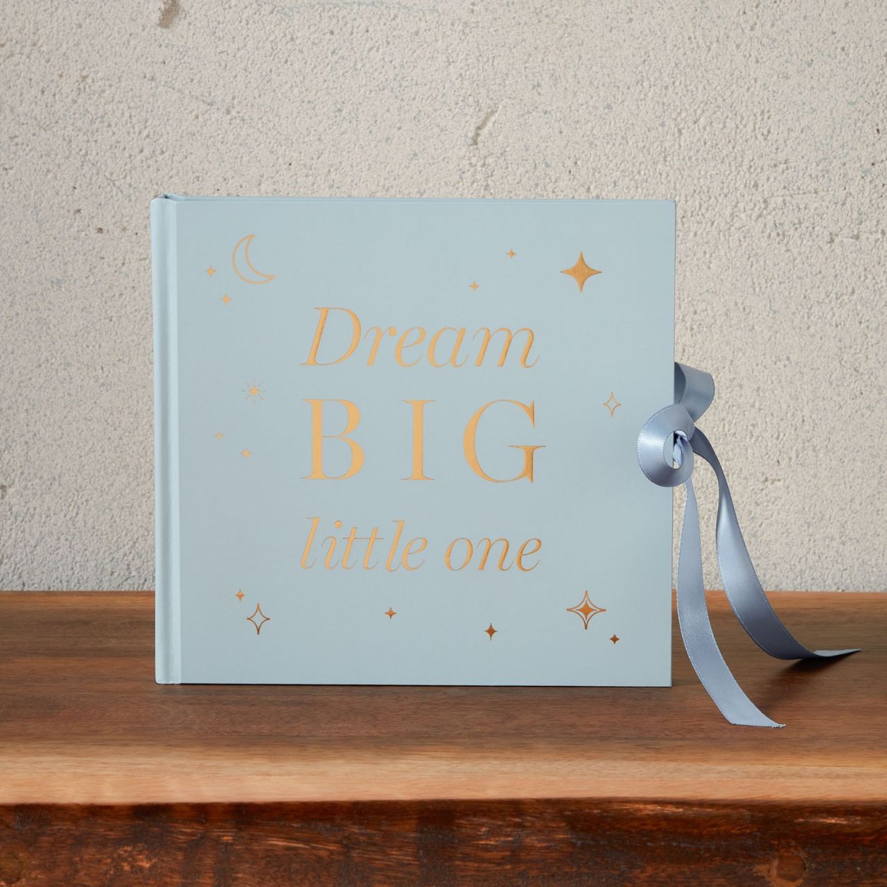 Bambino Photo Album "Dream Big" Blue  A photo album from BAMBINO BY JULIANA.  This alluring keepsake is an elegant way to preserve beloved memories of new family arrivals over the years.