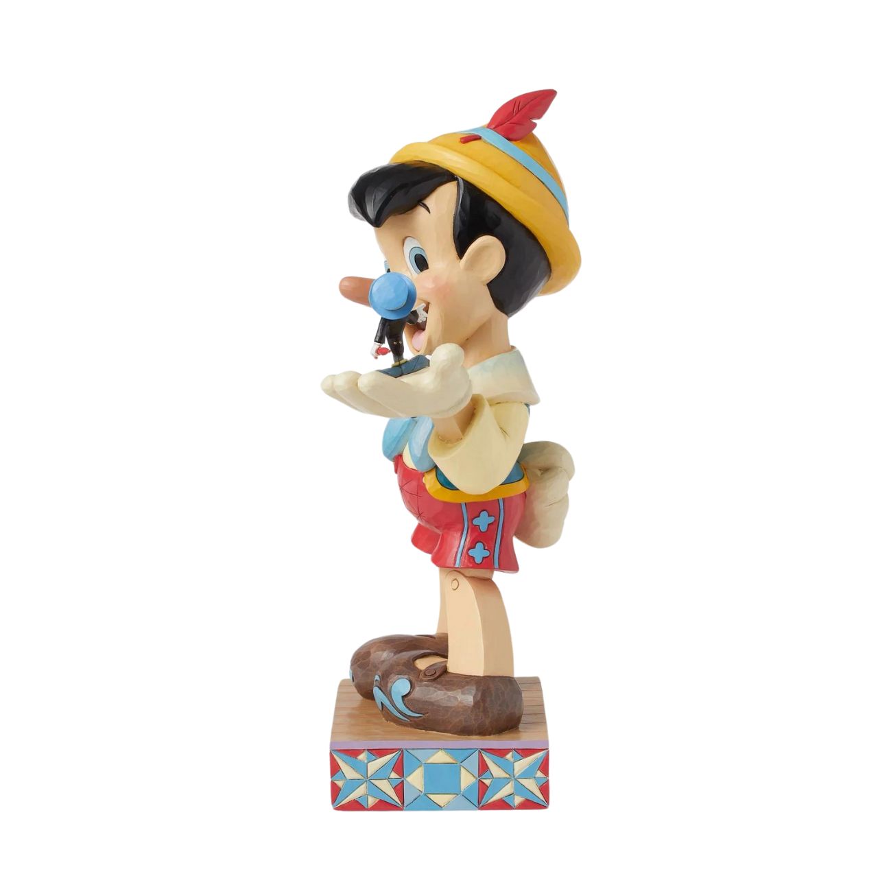 Disney's Pinocchio is the size of a real boy with this figurine. Hand carved and painted, this piece comes from the Disney Traditions collection by Jim Shore. This impressive piece comes packaged in a fully branded gift box.