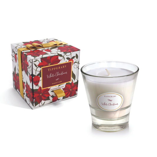 White Christmas Poinsettia Tumbler Candle by Tipperary  A classic Christmas fragrance with warm notes of orange spice amber and musk. Bringing festive cheer to your home.  "Inspired by the warm, spicy aromas of the festive season Tipperary has produced the most beautiful collection of Christmas-inspired scented candles and fragrance diffuser sets all of which are presented in exquisitely designed festive gift boxes.