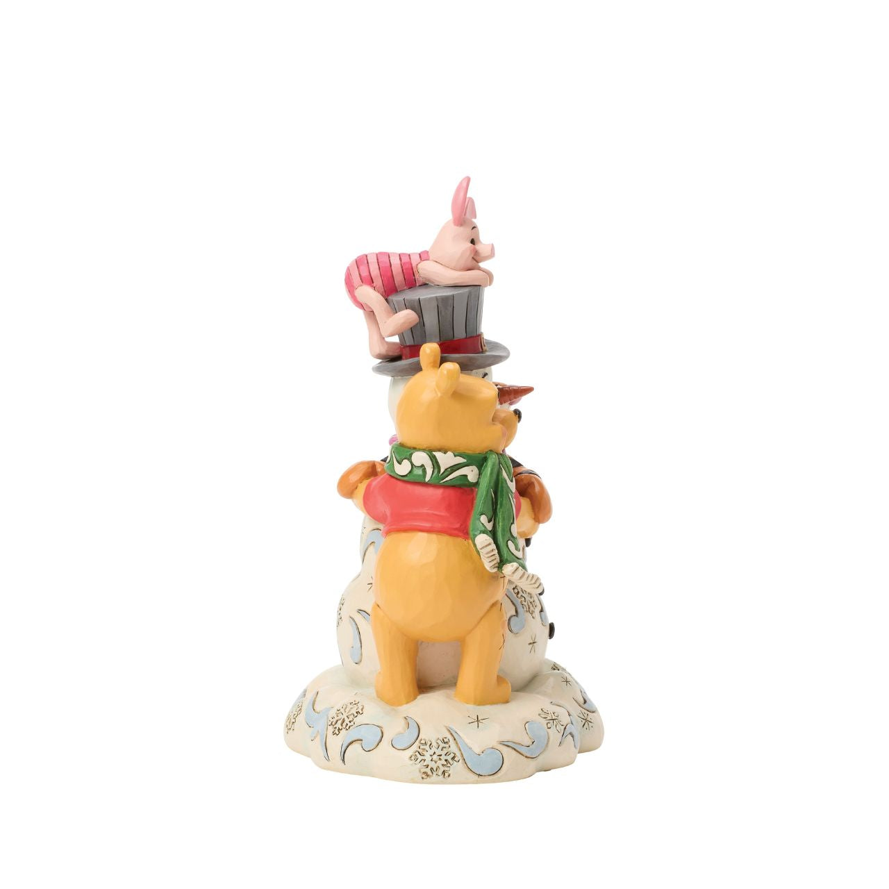 Pooh, Tiger, and Piglet build winter magic together in this cosy Jim Shore design. With bright scarves, rosy cheeks, and a jolly snowman, the scene captures the charm of snowy adventures and the sweetness of friendship with Jim Shore's iconic style.