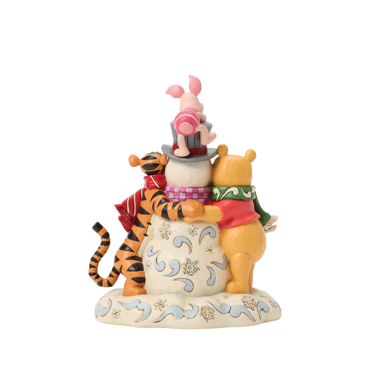 Pooh, Tiger, and Piglet build winter magic together in this cosy Jim Shore design. With bright scarves, rosy cheeks, and a jolly snowman, the scene captures the charm of snowy adventures and the sweetness of friendship with Jim Shore's iconic style.