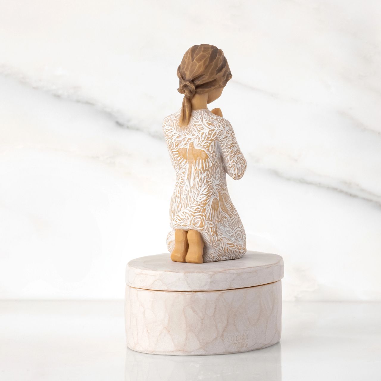 Prayer of Peace Keepsake Box by Willow Tree  ''I wanted this figure to be a humble piece, but very centering, calming, peaceful .. with a universal gesture of meditative thought. The surface of her dress is carved with texture and patterns of living natural forms. Even though this is a quiet piece, I wanted the imagery to be very alive with movement - to have an inner energy of life.'' - Susan Lordi.