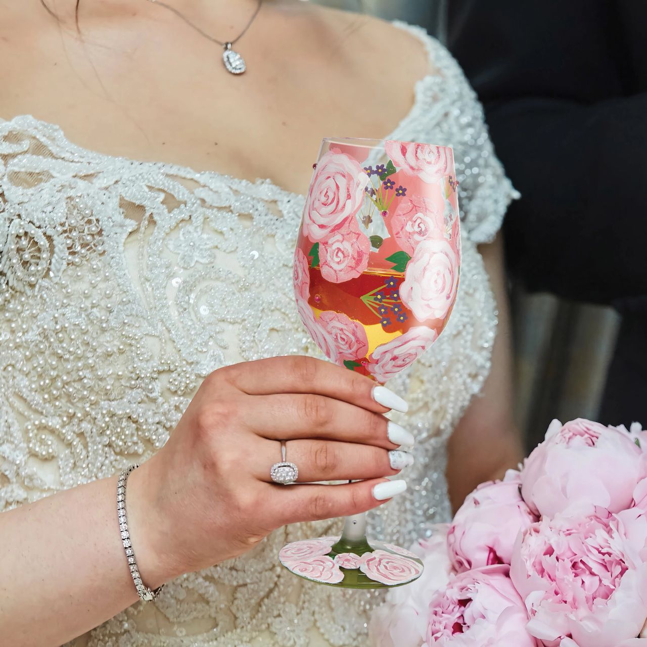 This picturesque wine glass from Lolita Designs brightens your beverage with beautiful blooms. With hand-painted pink roses and purple buds, this lovely cup comes to life with crystal ascents and tranquilizing colour.
