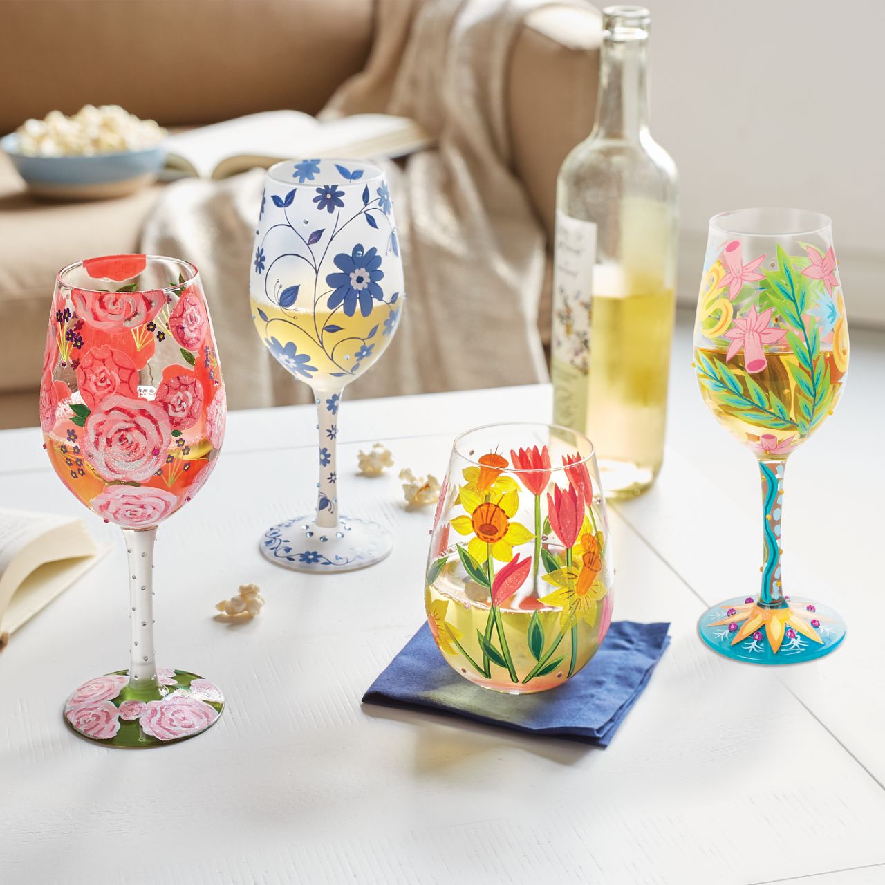 This picturesque wine glass from Lolita Designs brightens your beverage with beautiful blooms. With hand-painted pink roses and purple buds, this lovely cup comes to life with crystal ascents and tranquilizing colour.