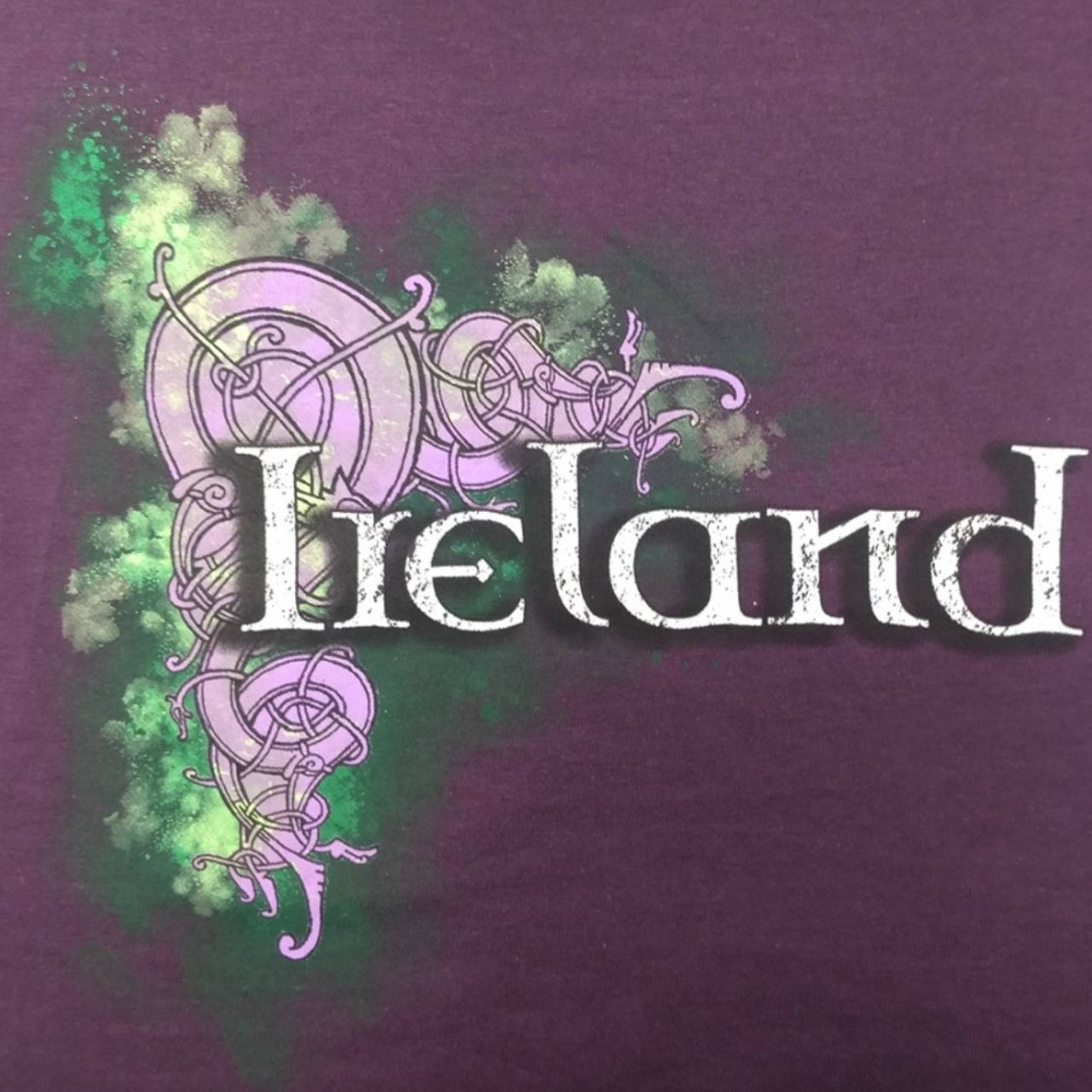 This purple ladies V-neck cotton T-shirt is a part of the Traditional Craft Official Collection. It is a fitted style and features a distressed print of a Celtic design and an Ireland logo.
