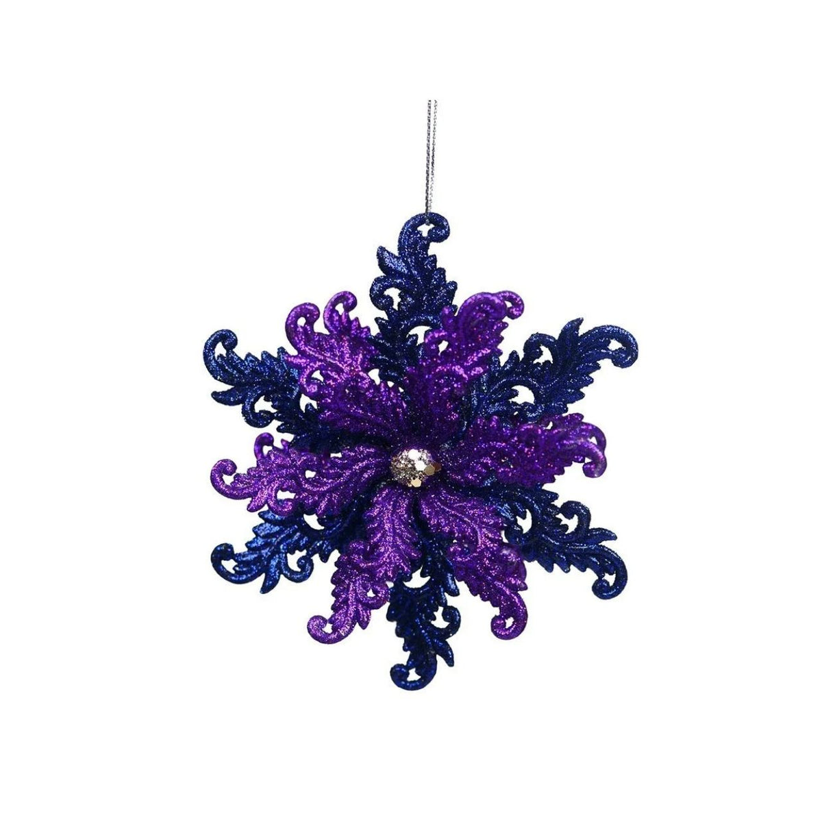 A glittery snowflake Christmas ornament in purple and dark blue, featuring a small clear rhinestone at the center and a silver hanging loop at the top, shown against a plain white background.
