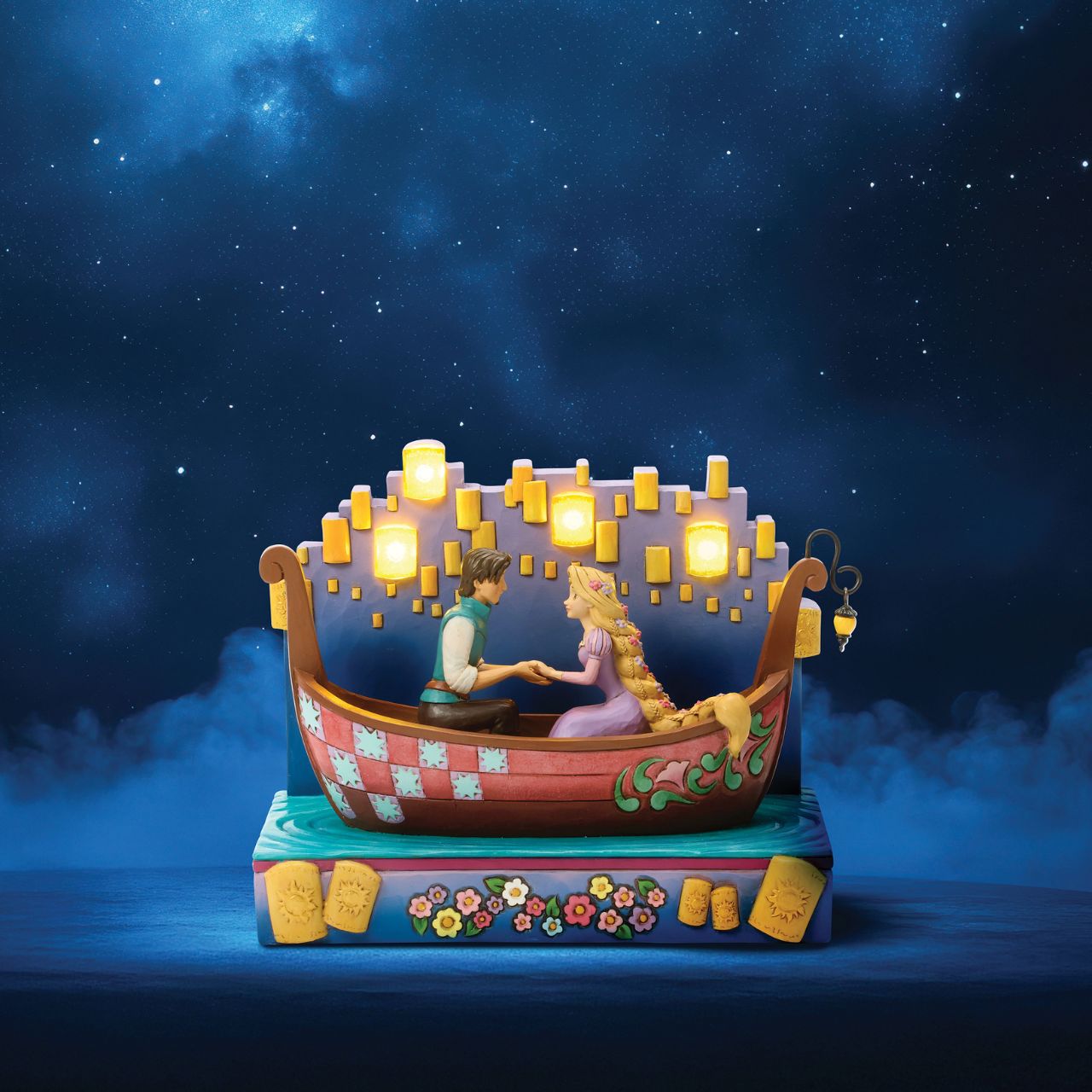In this beautiful Jim Shore design, Rapunzel and Flynn Rider share a romantic boat ride through glowing LED floating lanterns. Capturing the enchantment, Rapunzel's charm shines with flowers in her hair.
