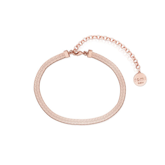 Romi Herringbone Chain Bracelet Rose Gold  This elegant and timeless bracelet by Romi features a herringbone chain crafted in sleek rose gold. Perfect for any occasion, this classic piece of jewelry can elevate any look.