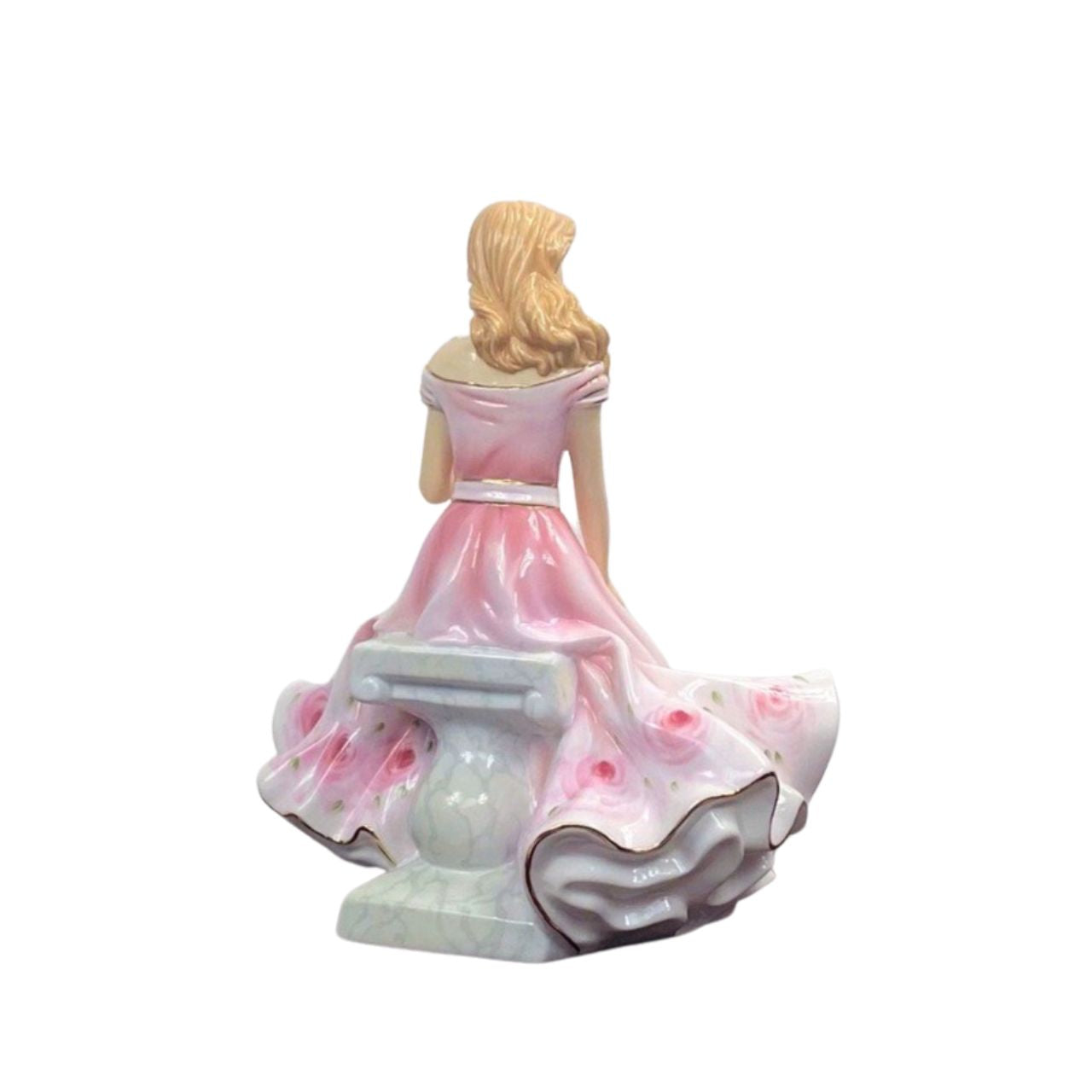 Royal Doulton Rose British Flower Ladies Limited Edition Figurine  No.6 of 350  At one with nature & captured in a moment of quiet contemplation seated atop a marble plinth. This angelic lady, attired in a dress of subtle pink tones and wonderfully complemented with marvellously decorated roses at its hem, is lost in the romance held within the lines of a poem whilst sharing her thoughts in the company of a passing butterfly.