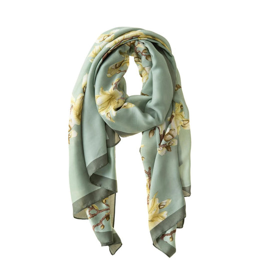 Sage & Apple Blossom Polyester Scarf  Our Sage & Apple Blossom Polyester Scarf is the perfect rich colour that will draw attention and complement any outfit. This rich, soft and comfortable scarf is a must have and also comes in a beautiful box ready for gifting. A touch of luxury for everyday life and perfect for all seasons.