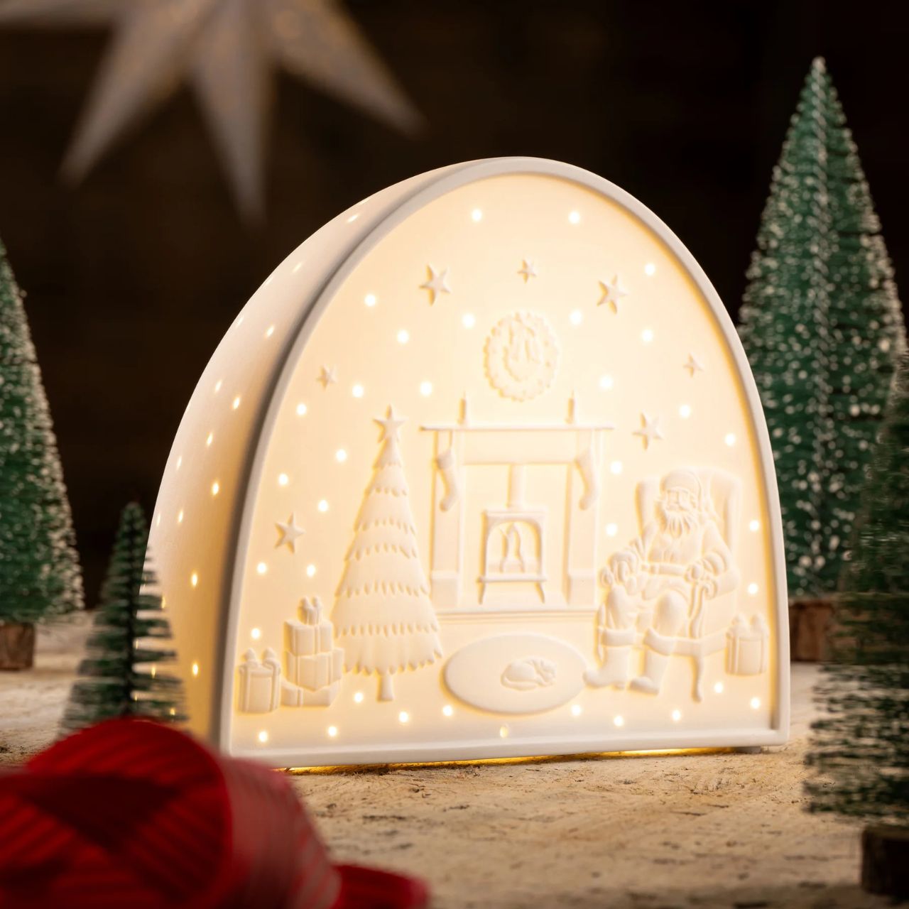 The Santa by the Fire Luminaire has been exquisitely modelled and depicts the classic Christmas Scene. The back is delicately pierced and casts beautiful shadows when illuminated.