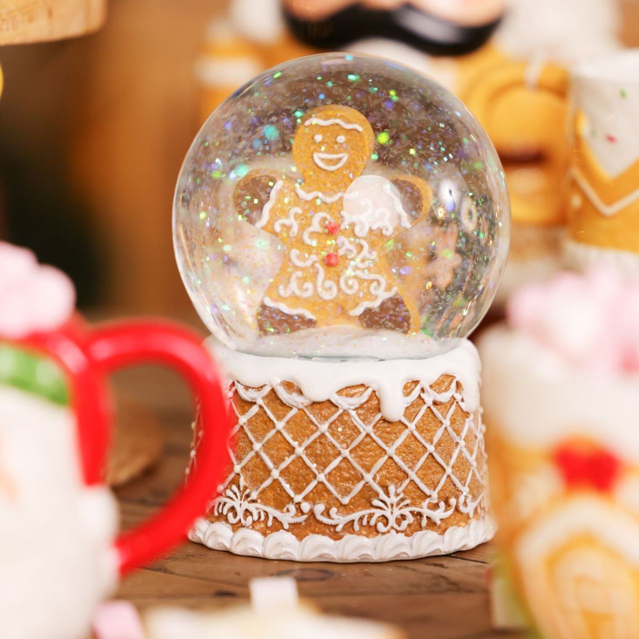 Delight in the festive spirit with the Santa & Friends Gingerbread Tree Snow Globe - 14cm, a charming item for your seasonal range.