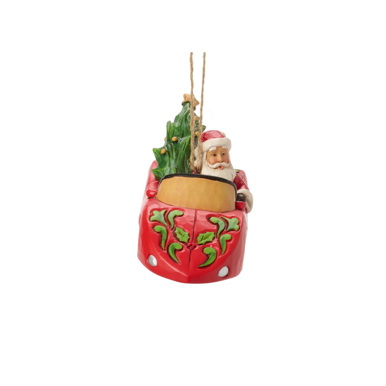 This playful Jim Shore Christmas ornament features Santa cruising in a red sports car adorned with holly, his face beaming with holiday joy. With a Christmas tree and presents packed in the back seat, Santa is ready to spread cheer in sporty style.