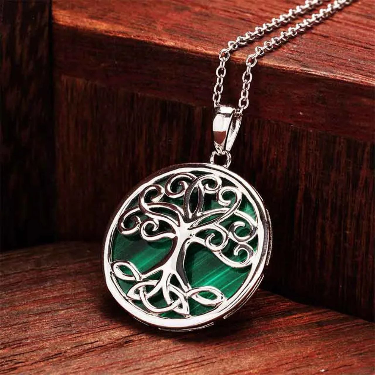 Shanore’s Green Malachite Sterling Silver Tree of Life Pendant Necklace inspires the wearer to find her roots and reach the sky. Green malachite reminds of rich foliage and helps inner transformation. Likewise, the Celtic Tree of Life symbolizes riches and rebirth.