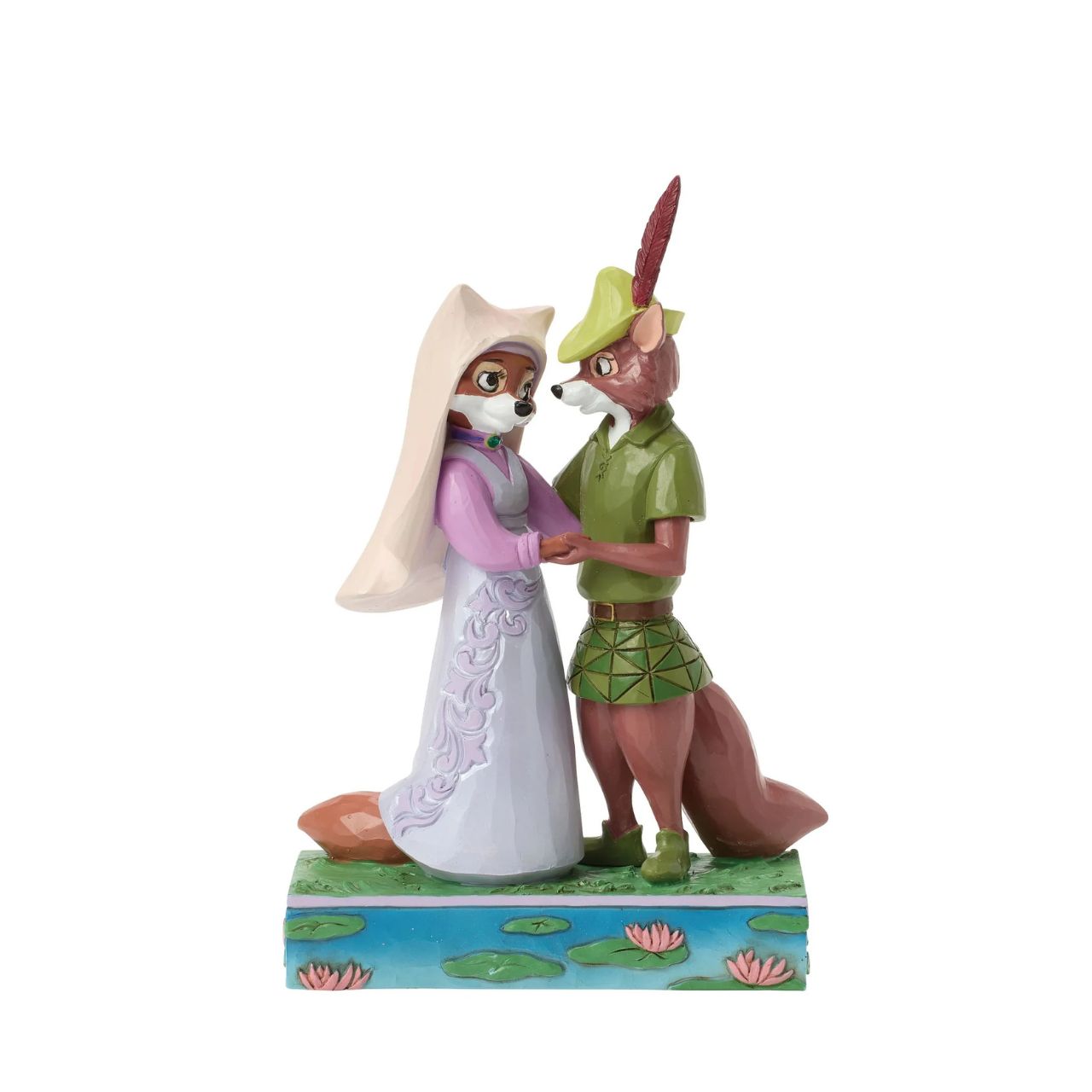 This Jim Shore rendition of Robin Hood and Maid Marian stand hand in hand, gazing into each other's eyes. Adorned with the artist's signature patchwork and rosemaling details, the piece captures the romance and adventure of their timeless story.