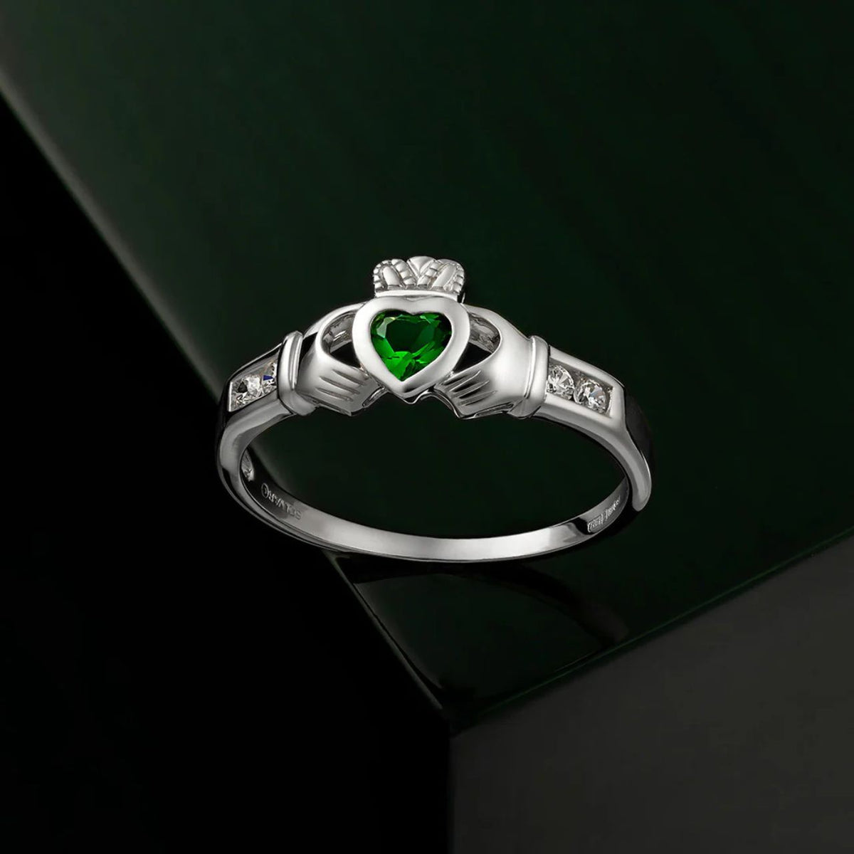 This beautiful sterling silver Claddagh emerald ring features a green heart at the centre to symbolise love for the Emerald Isle.