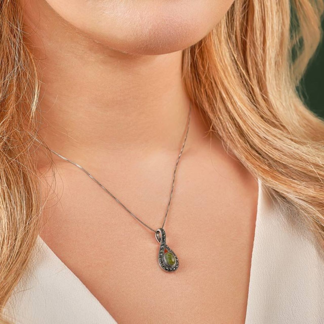 This stunning necklace has been crafted in sterling silver with Connemara marble and embellished with marcasite for an added sparkle. Connemara Marble is referred to as "Ireland's Gem Stone".