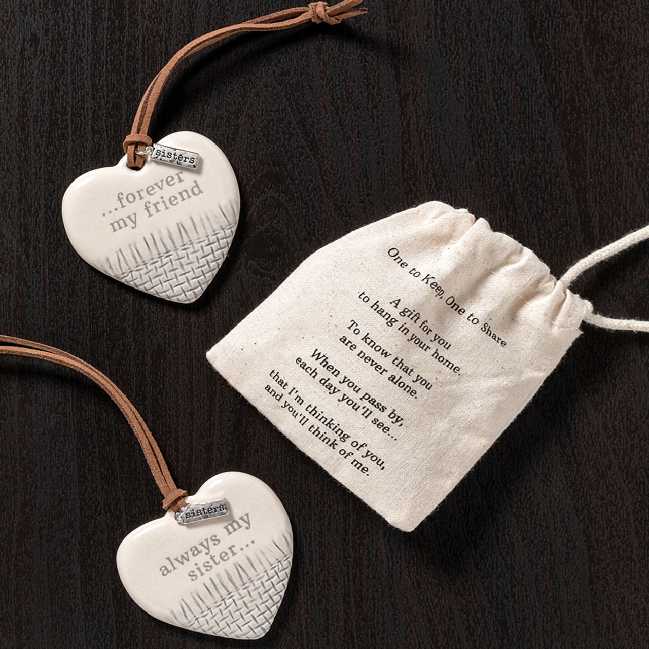 Sisters One to Keep, One to Share Ornament Set  Give your sister the perfect gift with the Sisters One to Keep, One to Share Ornaments set. Sentiment reading Always my sister; Forever my friend shows the powerful relationship between two sisters. Give one to her in the gift bag and keep one for yourself. The ornaments can always be kept on you or hung somewhere special as a reminder.