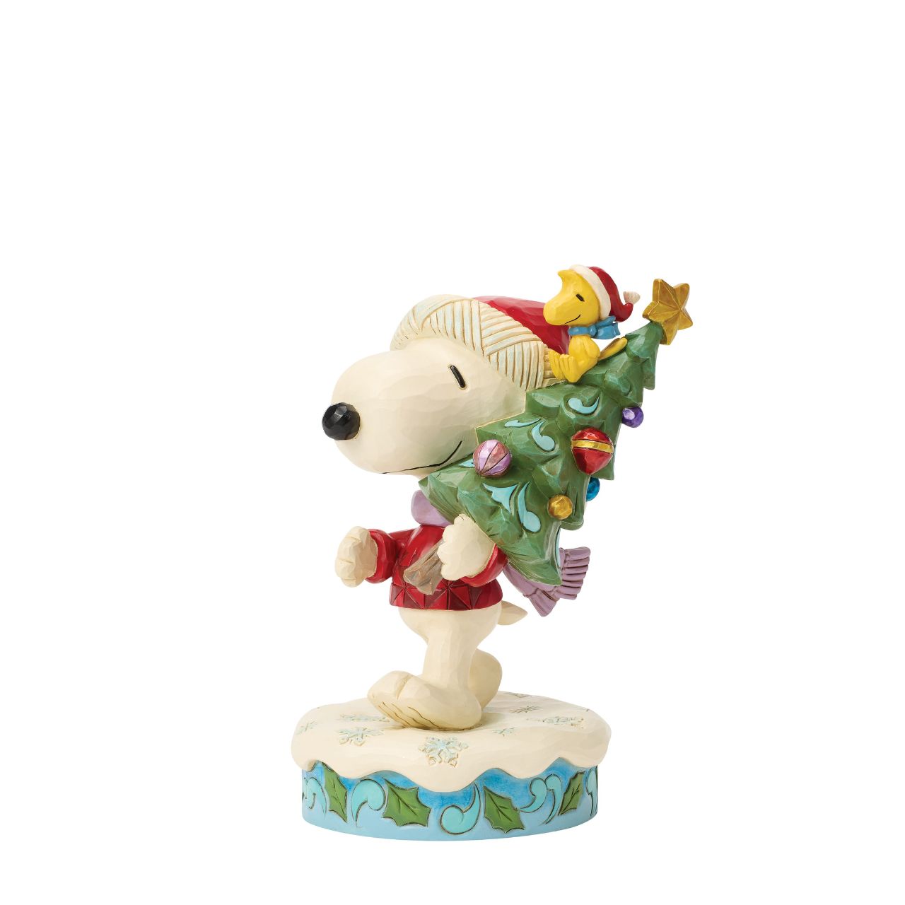 Snoopy and Woodstock bring home a decorated Christmas tree in this heart warming Jim Shore scene. With festive folk art touches, it's a charming reminder of holiday traditions and lifelong friendship. Celebrate the season with your favourite Peanuts.