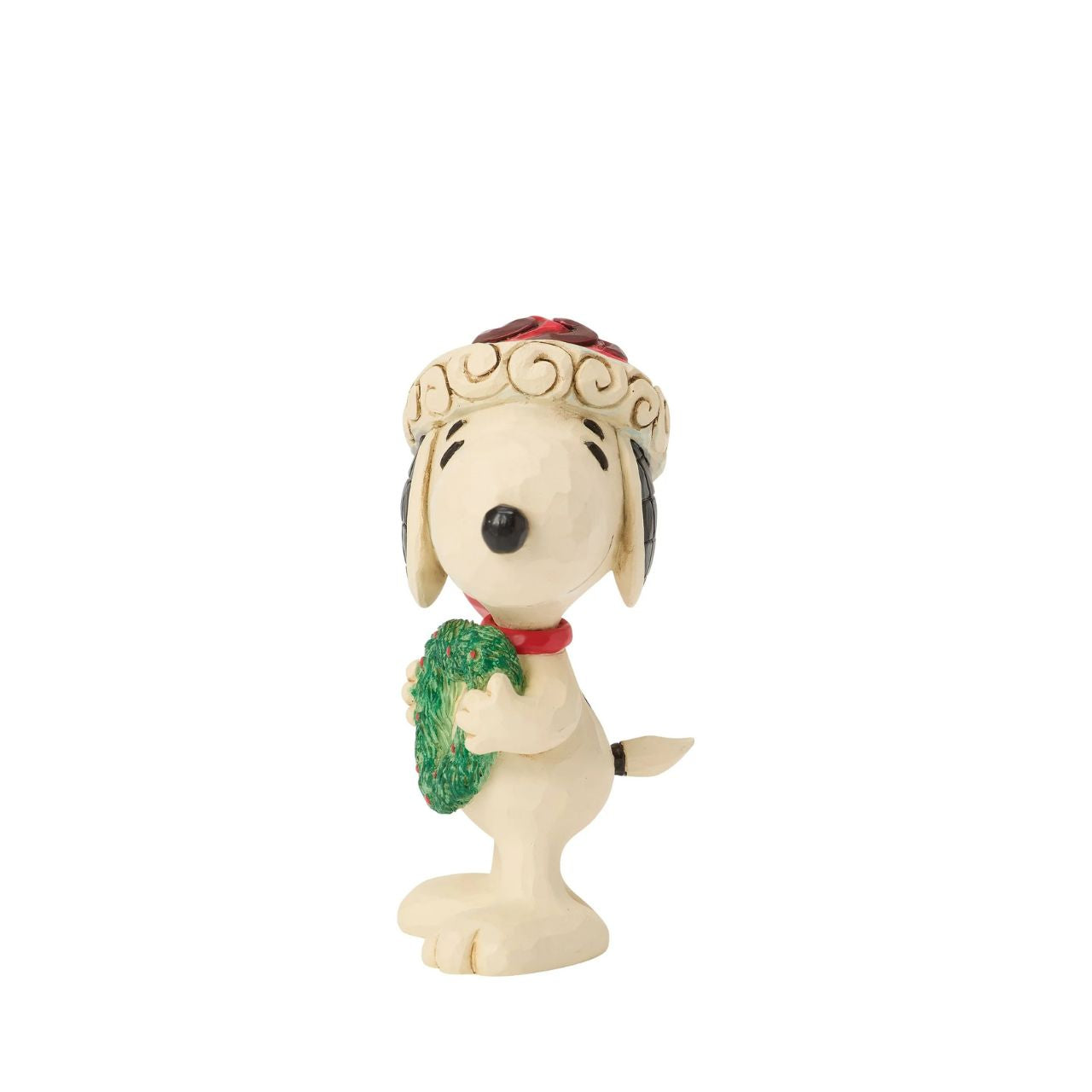 Snoopy holds a heart-shaped wreath in a Santa hat in this darling Jim Shore figurine. Small yet full of holiday charm, it celebrates friendship and Peanuts nostalgia with Christmas warmth.