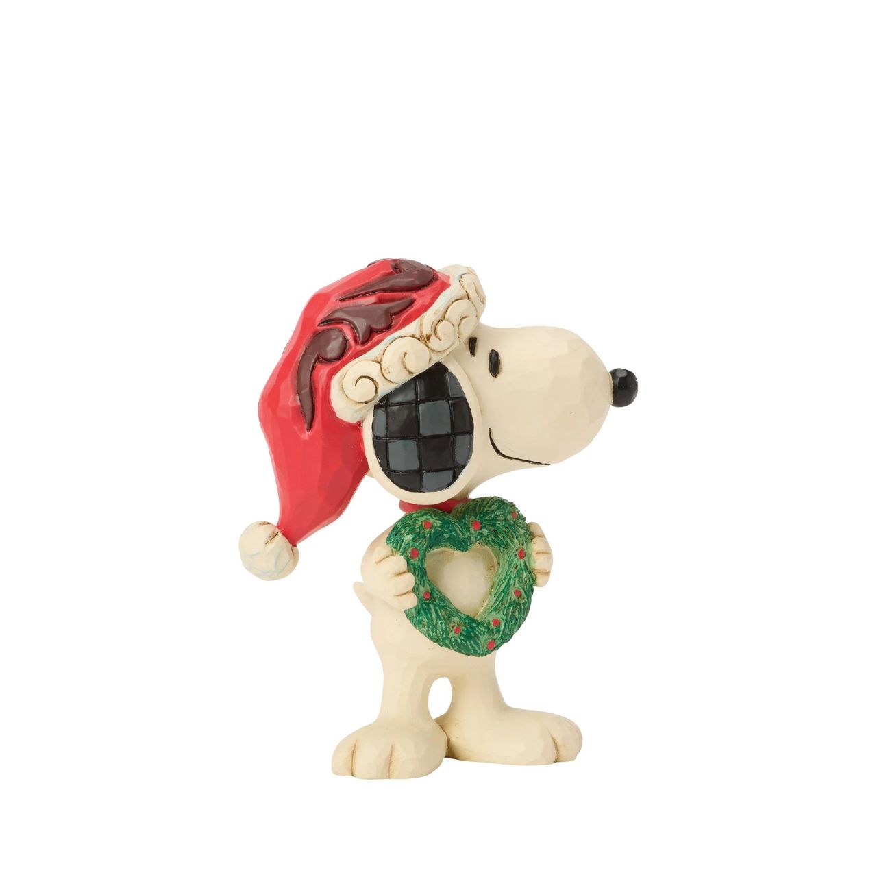 Snoopy holds a heart-shaped wreath in a Santa hat in this darling Jim Shore figurine. Small yet full of holiday charm, it celebrates friendship and Peanuts nostalgia with Christmas warmth.