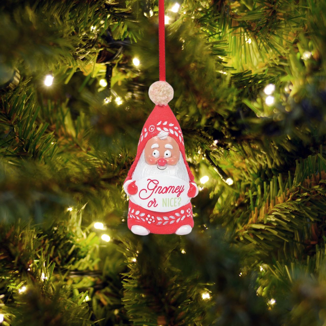 Are you on Santa's nice list this year? This Snow Gnome wants to know. He is hand crafted from high quality cast stone, hand painted by our skilled artists and then topped with a real pom pom. Hanging from a festive red ribbon, he is the perfect accessory to any Christmas Tree.
