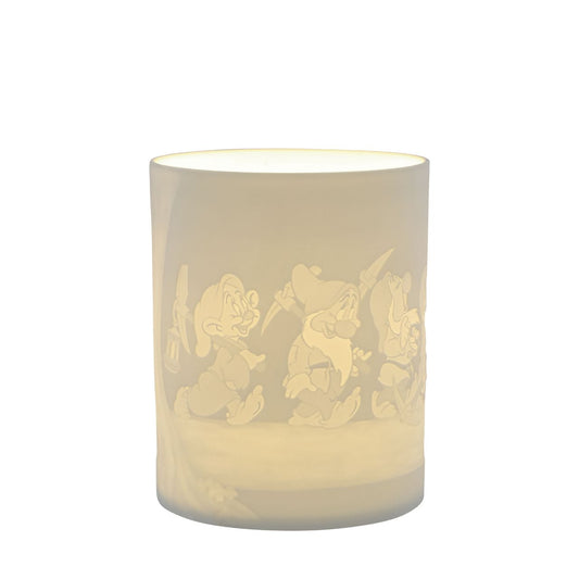 Snow White & The Seven Dwarfs Porcelain Tea Light Holder  The Seven Dwarfs will seem as if they are returning home from work when you light the LED candle and they flicker across your room creating a warm night light. The Seven Dwarf characters from Disney's Snow White are etched into the thin translucent porcelain.