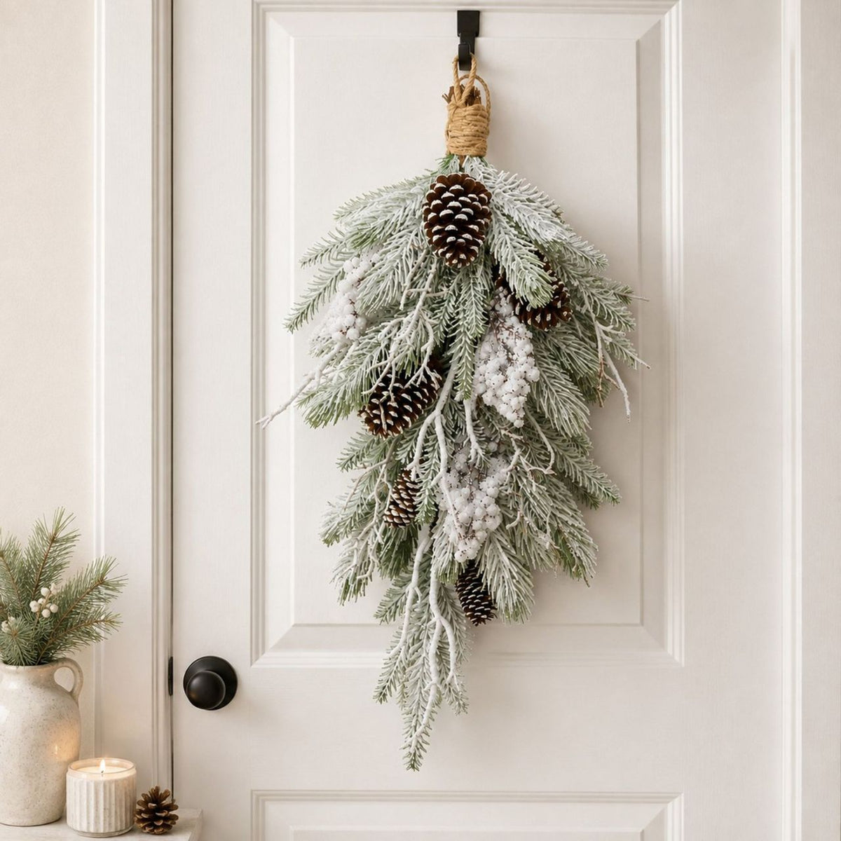 Add a touch of winter charm to your space with The Seasonal Gift Co.'s Snowy Pine Foliage with Cone Decoration.