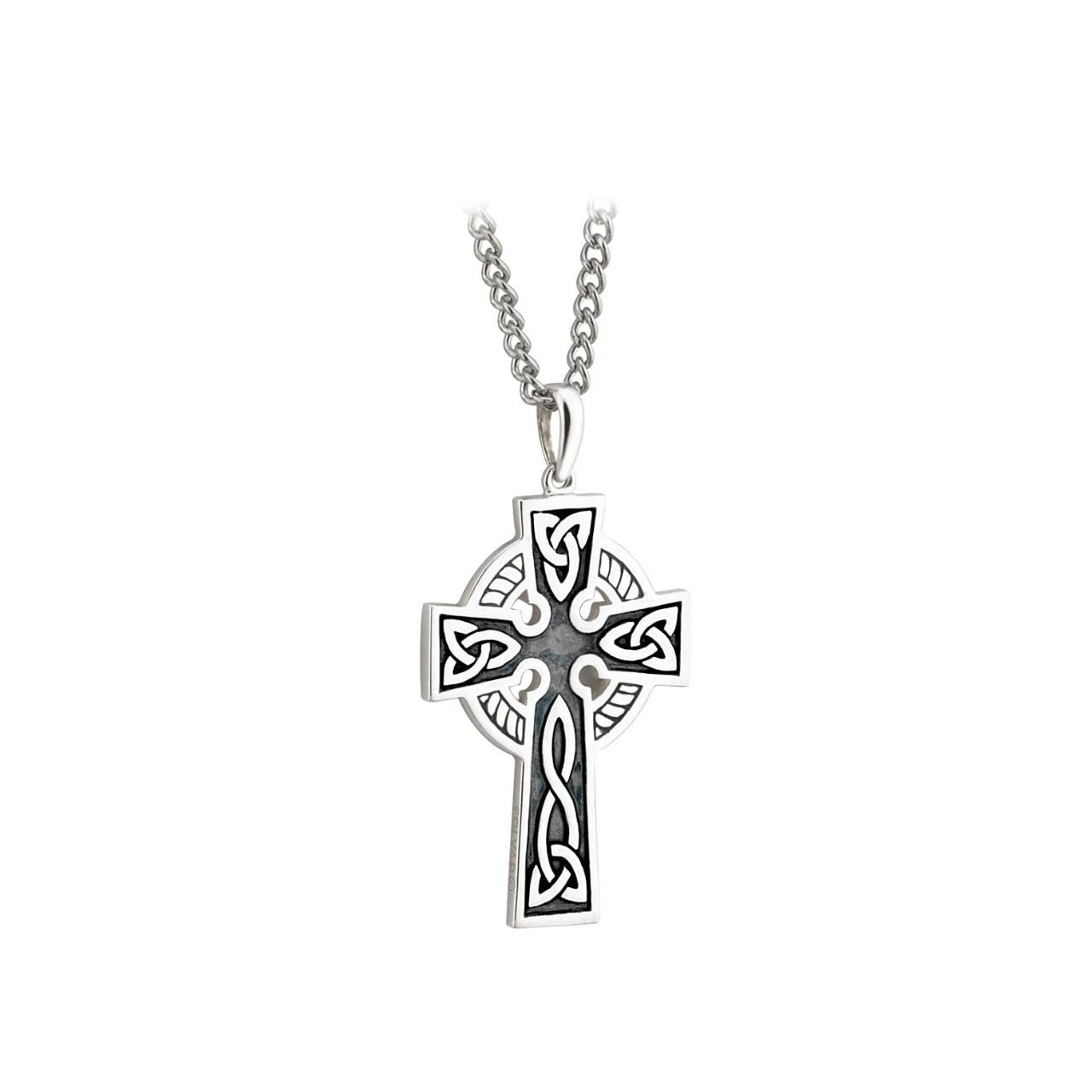 This double-sided Celtic cross pendant is crafted from sterling silver and oxidised to give the necklace an aged look. The colour of the oxidised part of the necklace may vary, resulting in slight differences between the pendant shown and the one you'll receive.