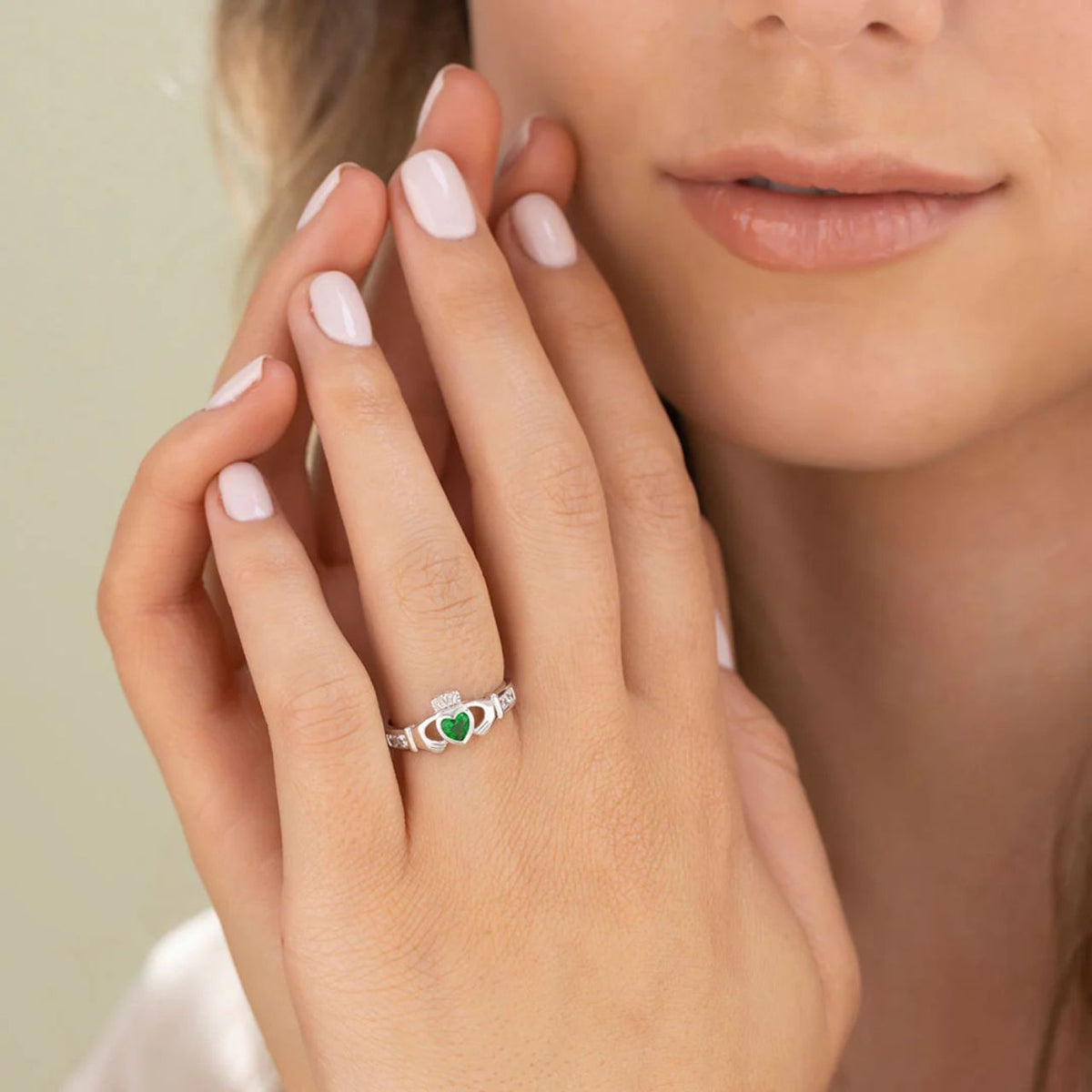 This beautiful sterling silver Claddagh emerald ring features a green heart at the centre to symbolise love for the Emerald Isle.