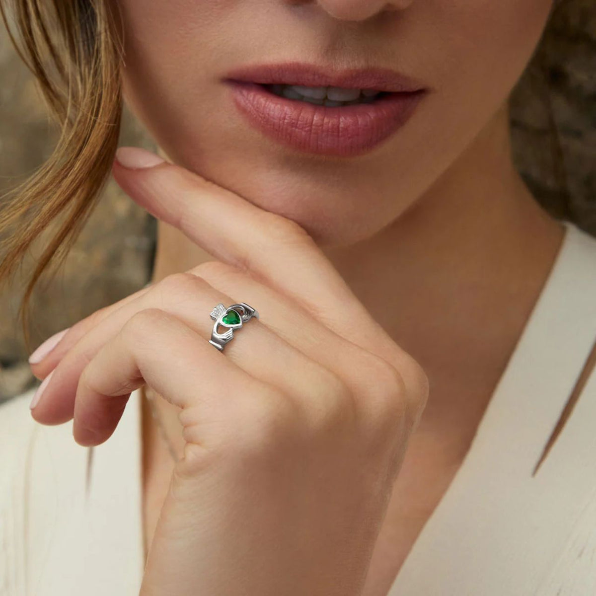 This beautiful sterling silver Claddagh emerald ring features a green heart at the centre to symbolise love for the Emerald Isle.